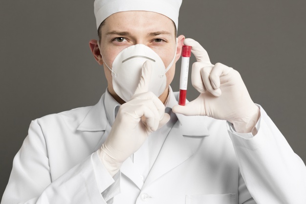front-view-doctor-with-medical-mask-holding-up-vacutainer-making-quiet-sign_23-2148445049.jpg